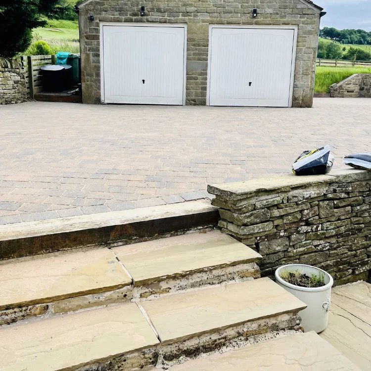The same driveway and steps after pressure washing