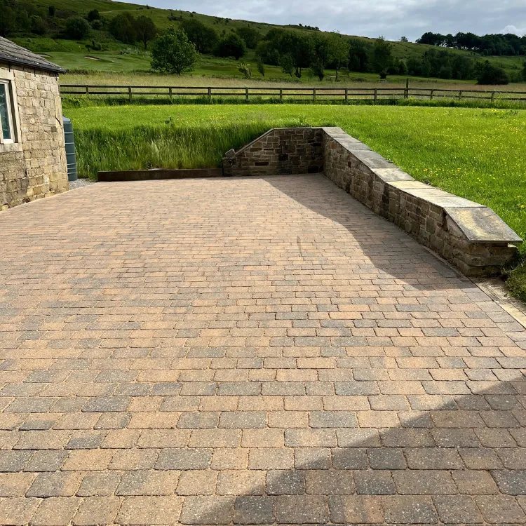 The same block paving after pressure washing, back to its buff colour