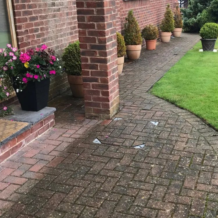 Block paved front path in Sandmoor before cleaning, dull and grey