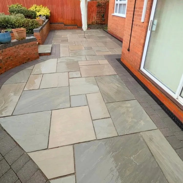The same sandstone patio after jet washing