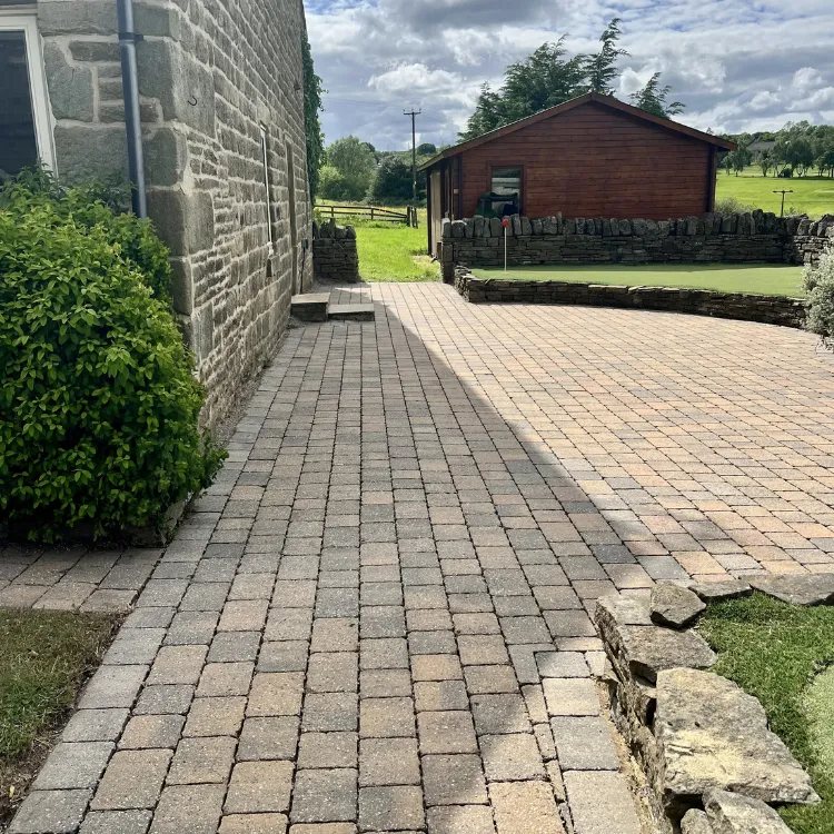 The same block paving after pressure washing, weeds gone