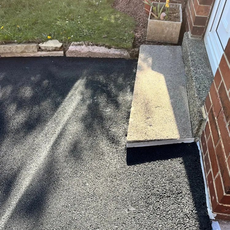 The same tarmac beside the doorstep after restoration