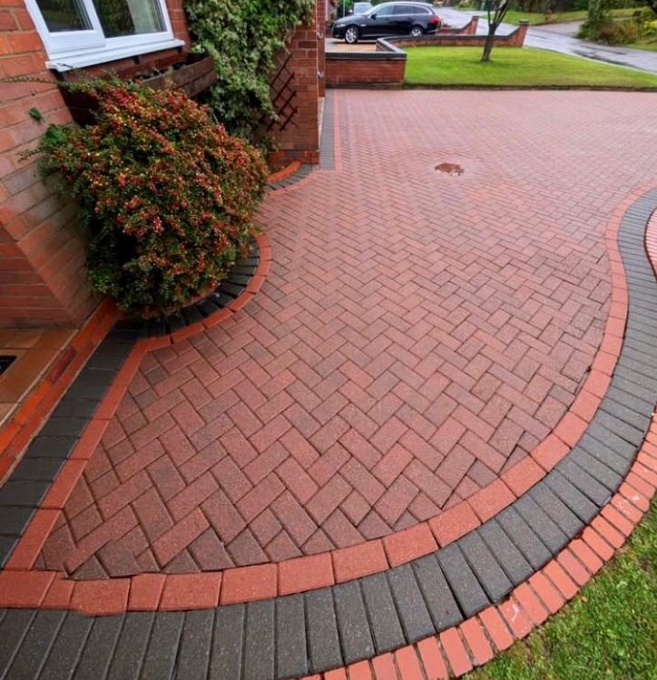 Clean red block paving with a charcoal border