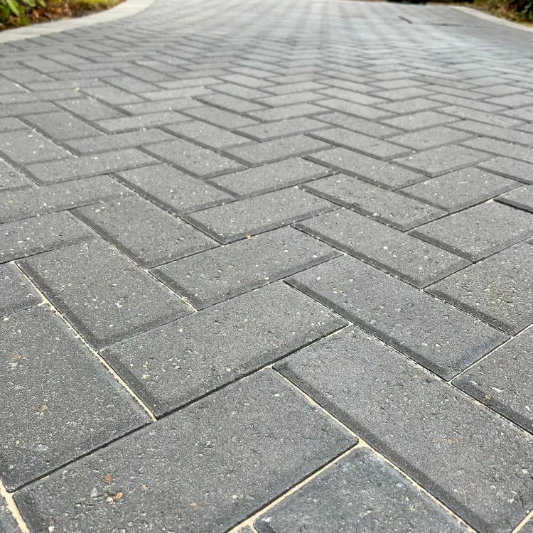 Close up of grey block paving with freshly sanded joints