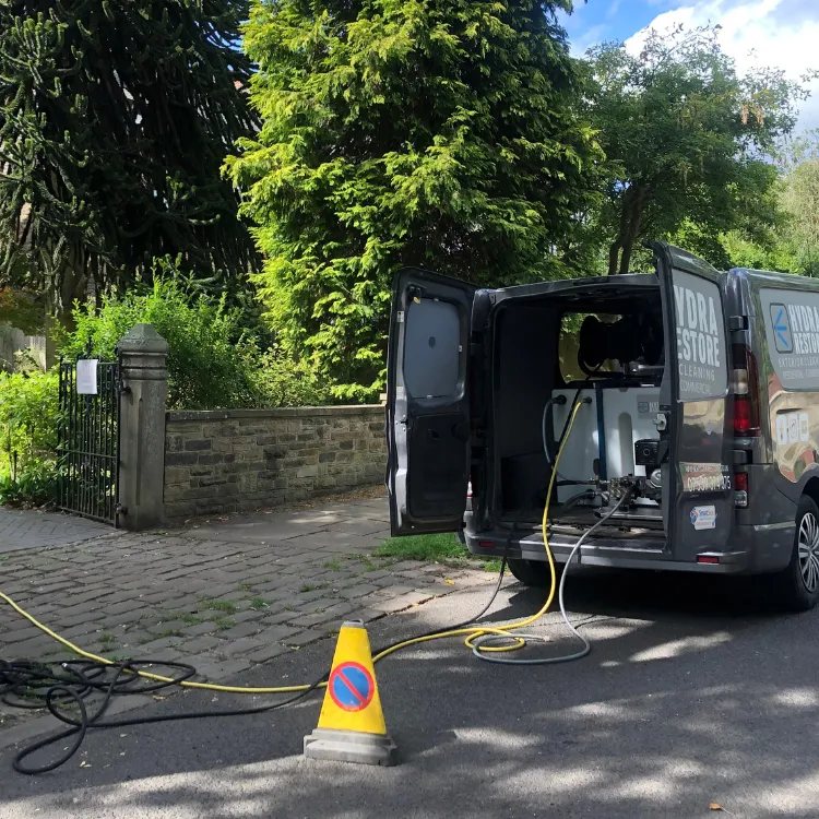 The Hydra Restore van parked on a job with its rear doors open and hoses run out