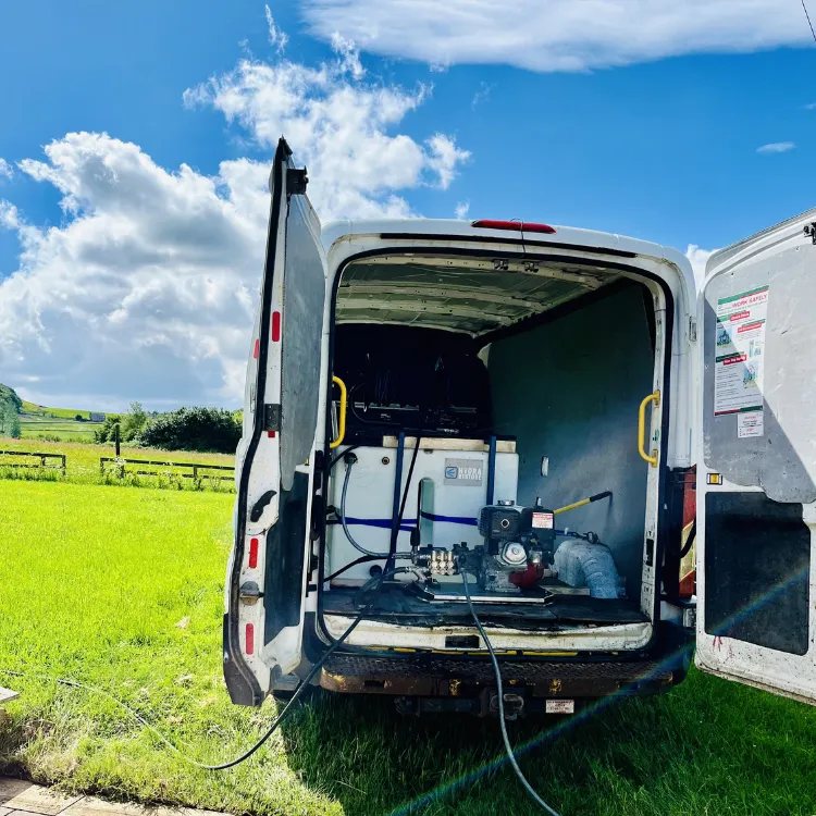 The Hydra Restore van with its rear doors open, showing the water tank and the pressure washer engine